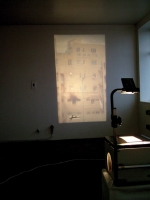 - Installation view of projected image with signed wall